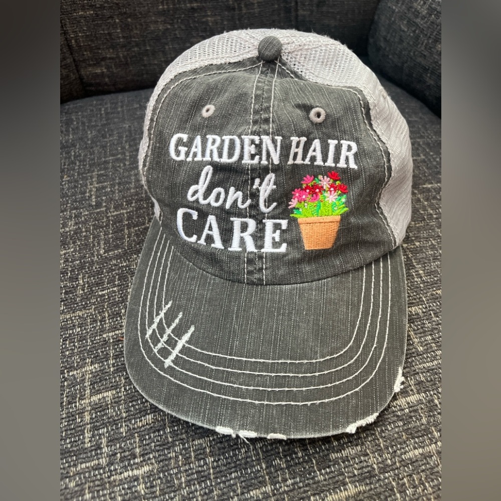 Gray and White rustic Hat with “ Garden hair don’t care” embroidered on it